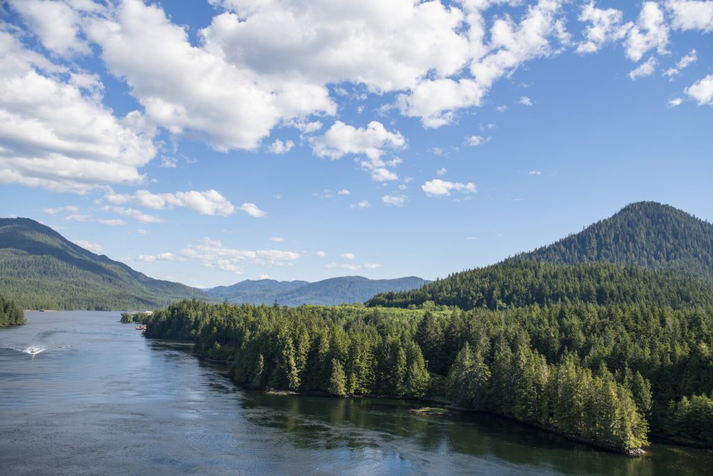 Prince Rupert, view from above of boat on ocean and forest/mountains to the right