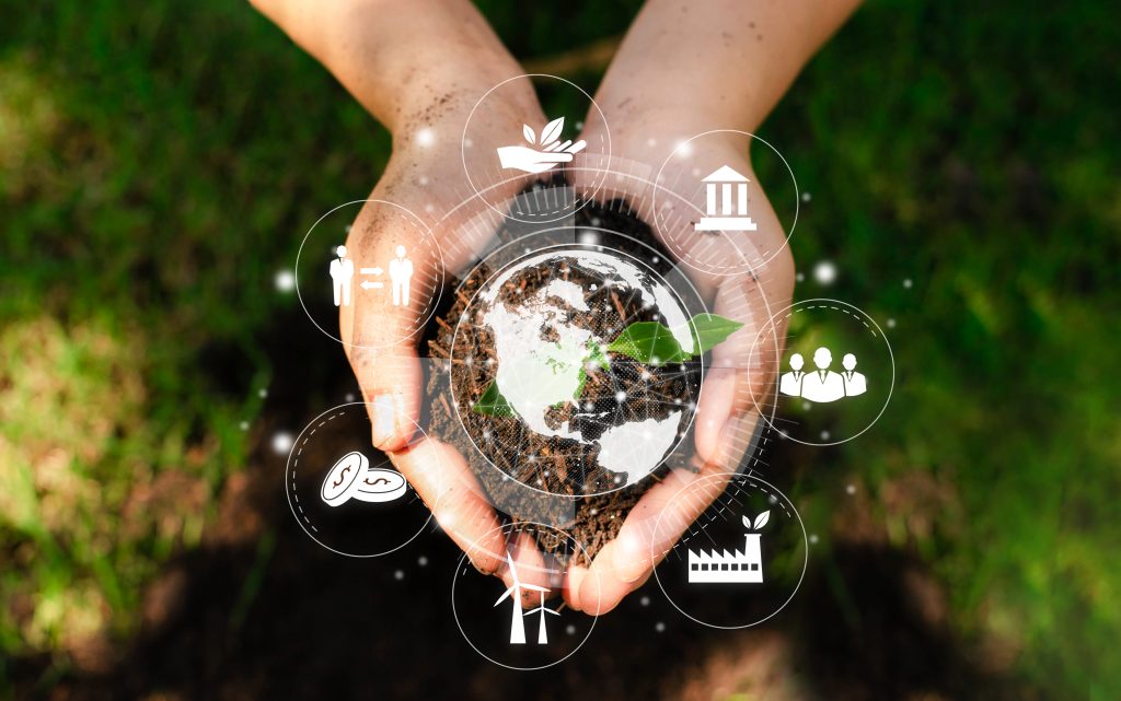 ESG conceptualized: hands holding holding a seedling with an overlay of icons symbolizing Environmental, Social, and Governance.